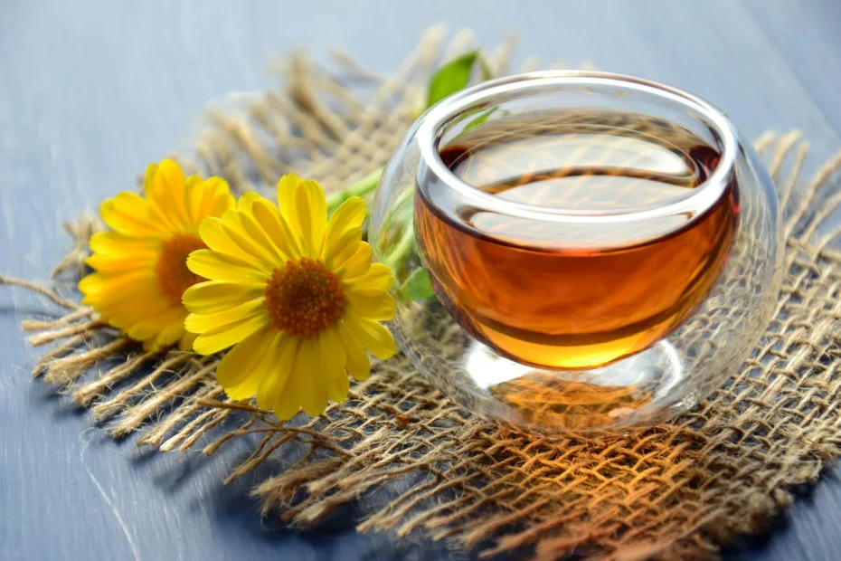 clear glass bowl beside yellow flower